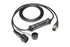 Ein schwarzes HUK Juice Booster 3 air HUK-Set Diagnosekabel mit Multipin-Stecker, Kontrollleuchten und Schutzkappe – kompatibel mit mobiler Ladestation – aufgewickelt auf weißem Untergrund.